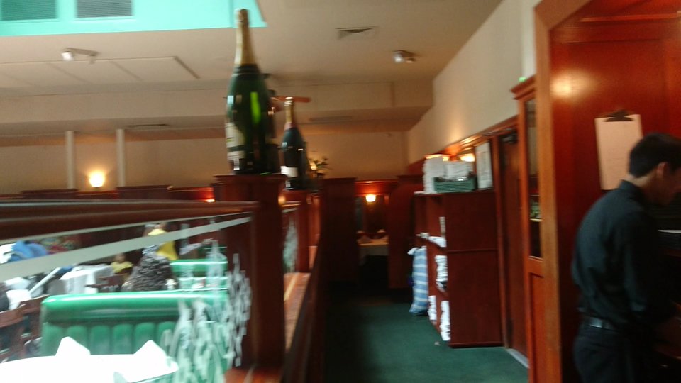 Mahogany bar with classic steakhouse seating.