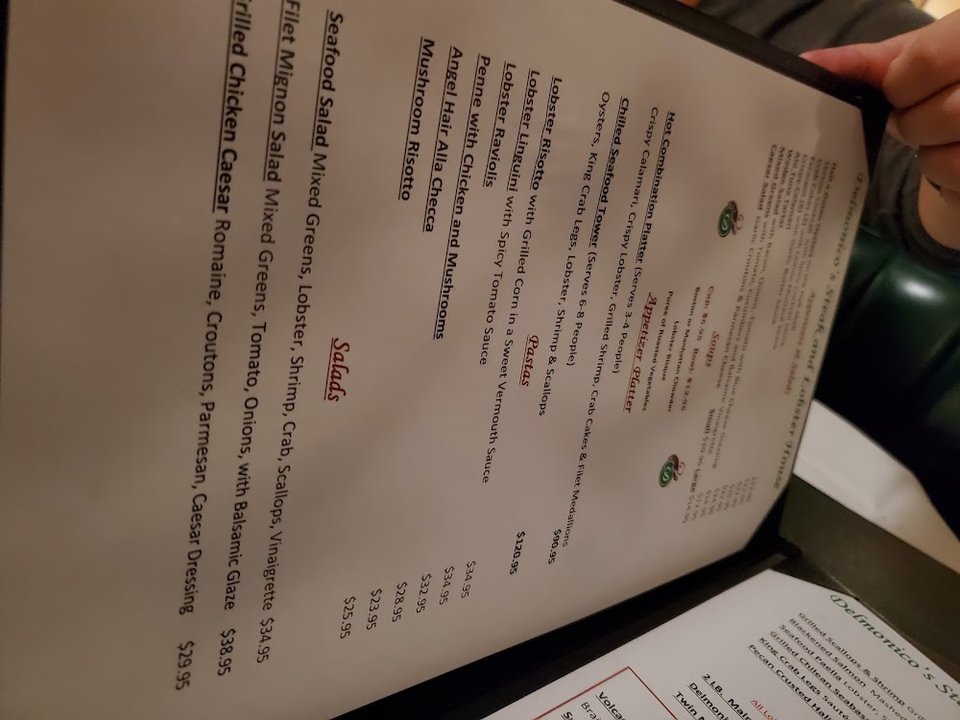 Restaurant menu beside a classic steakhouse setting.